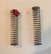 the pop-off spring on the left is old and brittle